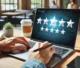 A person writing a Google review on a laptop, providing feedback for a business.